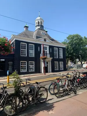 a group of bikes parked in front of a building at Bob W Oosterpark in Amsterdam