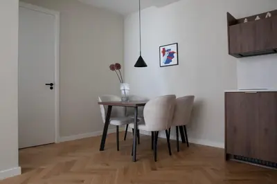 a dining room table and chairs in a room at Bob W Oosterpark in Amsterdam