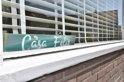 a window sill with a sign in a building at Casa Feliz in Egmond aan Zee