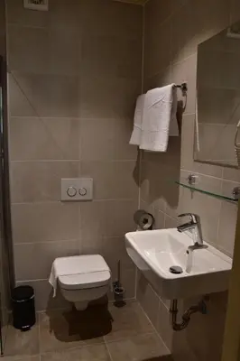 a bathroom with a toilet and a sink at OZO Hotels Armada Amsterdam in Amsterdam