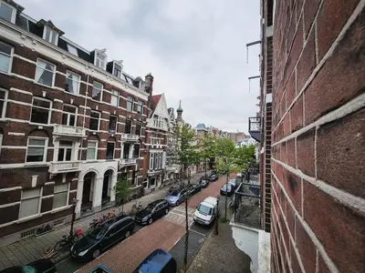 a view of a city street with cars parked at Hotel Vondel Garden in Amsterdam
