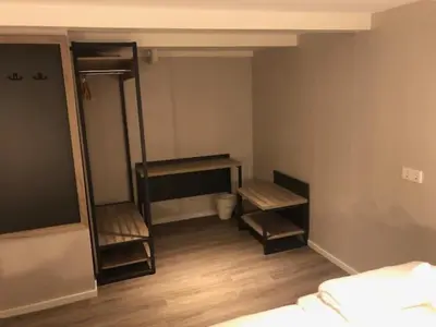 a bedroom with two bunk beds and a mirror at Facade Hotel Amsterdam in Amsterdam