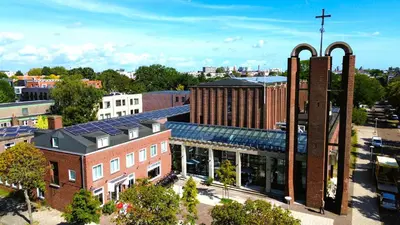an overhead view of a building with a church at Chasse Residency Hotel in Amsterdam