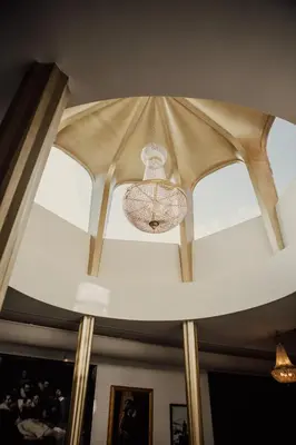 a chandelier hanging from a ceiling in a room at Chasse Residency Hotel in Amsterdam