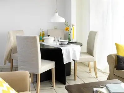 a dining room table with chairs and a black table at Amsterdam / Loosdrecht Rien van den Broeke Village in Loosdrecht