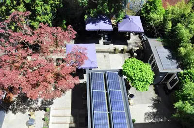an overhead view of a building with solar panels and trees at Huygens Place Amsterdam in Amsterdam