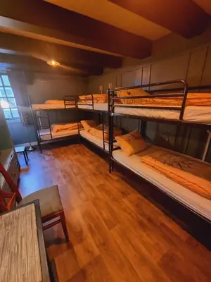 a room with a bunch of bunk beds in it at Amsterdam Downtown Hotel Canal View in Amsterdam