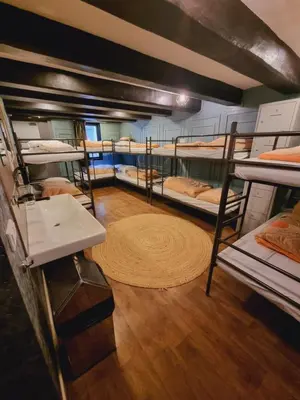 a room with a bunch of bunk beds at Amsterdam Downtown Hotel Canal View in Amsterdam