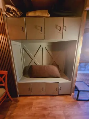 a large white cabinet with a pillow in it at Amsterdam Downtown Hotel Canal View in Amsterdam