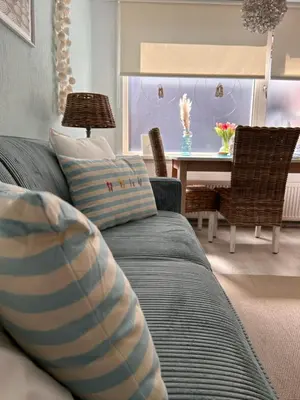 a living room with a couch and a table at Have a nice stay! - Voilà! - beach at 500m- free parking in Noordwijk aan Zee