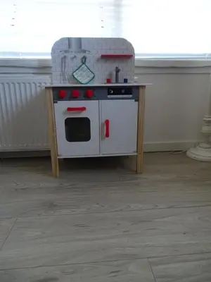 a toy kitchen with a pretend stove on a table at Guesthouse Wormer in Wormer