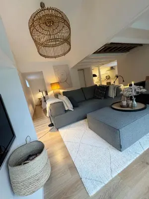 a living room with a couch and a table at Duinstudio Bergen in Bergen