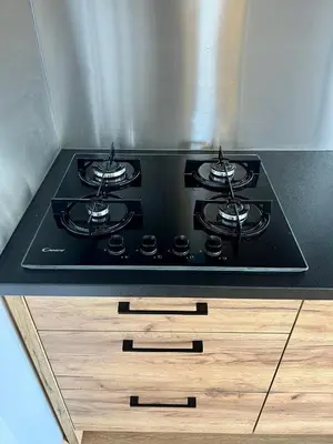 a stove top oven sitting on top of a counter at NEW - Little Asia - Stunning Boathouse on a lake Near Amsterdam with Sauna in Vinkeveen