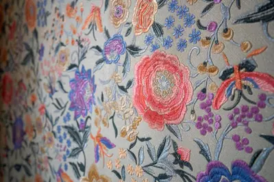 a close up of a flowered cloth with flowers at Aadam Wilhelmina Hotel in Amsterdam