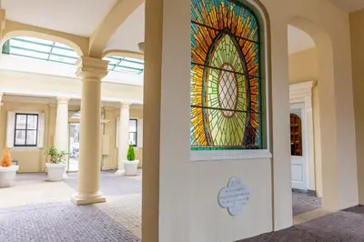a stained glass window on the side of a building at 1001 Nights Boutique Hotel in Haarlem