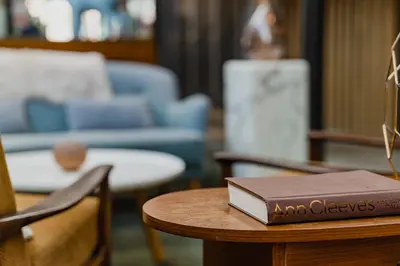 a book sitting on top of a table at Hotel De Hallen in Amsterdam