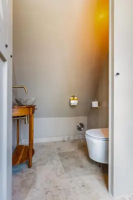 a bathroom with a sink and a toilet at Luxury private farmhouse cottage near Amsterdam plus home cinema in Ilpendam