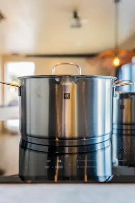 two large pots sitting on top of a stove at Luxury private farmhouse cottage near Amsterdam plus home cinema in Ilpendam