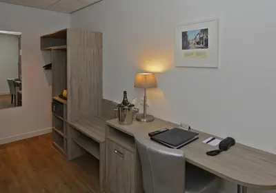 a office with a desk with a phone on it at Best Western City Hotel Woerden in Woerden