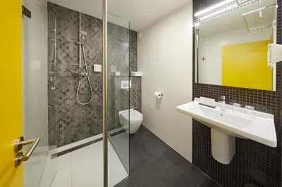 a bathroom with a sink and a shower at Nova Hotel in Amsterdam
