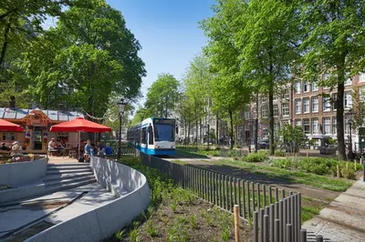 a bus is driving down a city street at Nova Hotel in Amsterdam