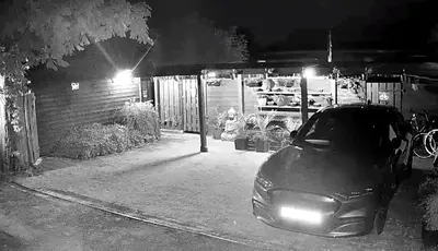 a car parked in a parking lot at night at Cozy comfortable house with jacuzzi & private garden near Amsterdam in Vijfhuizen