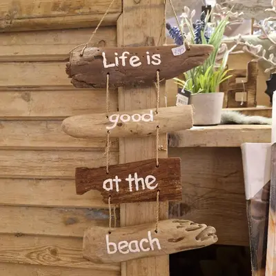 a sign that says life is good at the beach at Nordseeperle Dirkshorn Nordholland, mit Klimaanlage und Sauna in Dirkshorn