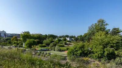 a view of the park from the hill at Strandhuis aan zee in Noordwijk