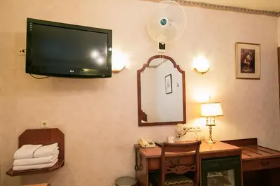 a room with a flat screen tv on the wall at Hotel Atlanta in Amsterdam