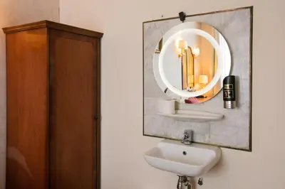 a bathroom with a sink and a mirror at Hotel Atlanta in Amsterdam