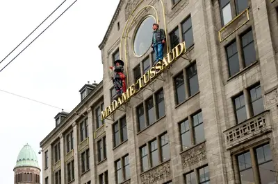 two men standing on the top of a building at Inntel Hotels Amsterdam Centre in Amsterdam