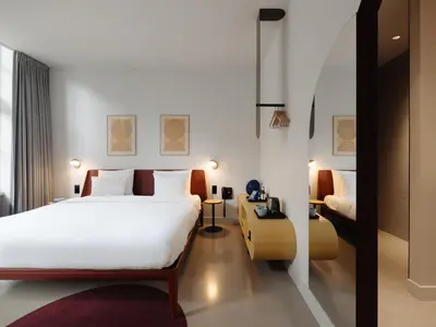 a hotel room with a bed and a desk at Conscious Hotel Museum Square in Amsterdam