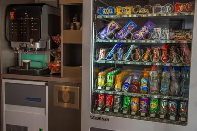 a refrigerator filled with lots of soda and drinks at Hotel City Garden Amsterdam in Amsterdam