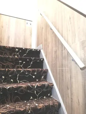 a set of stairs with a black and brown carpet at Budget Trianon Hotel in Amsterdam