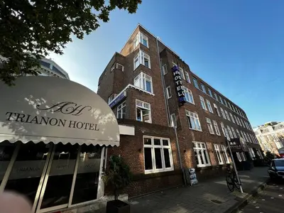 a brick building with an awning in front of it at Budget Trianon Hotel in Amsterdam