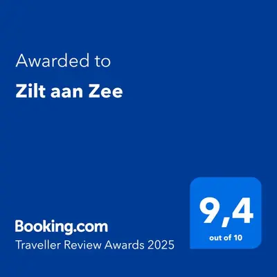 a blue screen with the text awarded to zhit an zee at Zilt aan Zee in Egmond aan Zee