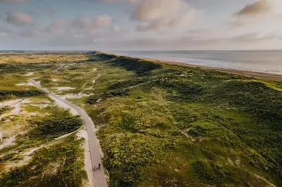 an aerial view of a road next to the ocean at Ozzy's Beach House in Zandvoort
