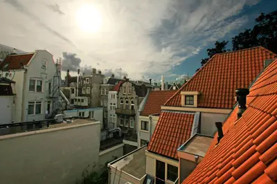 a view of a city with houses and roofs at A-Train Hotel in Amsterdam