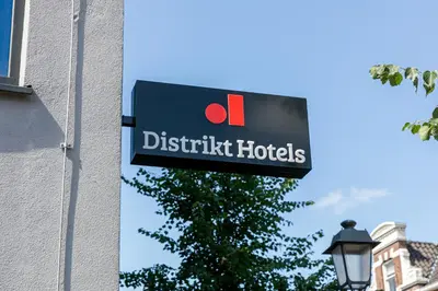 a sign on the side of a building at Distrikt Hotels Amsterdam Zaandam in Zaandam