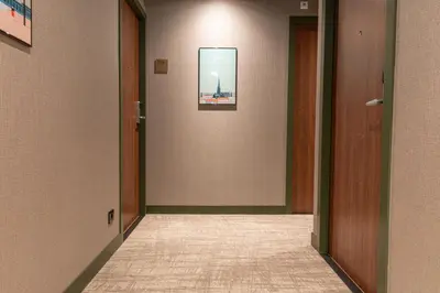 an empty hallway with a picture on the wall at Distrikt Hotels Amsterdam Zaandam in Zaandam