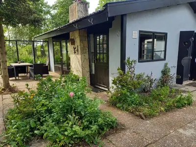 a house with a door and some plants at Natuurhuisje Eartswoud in Aartswoud