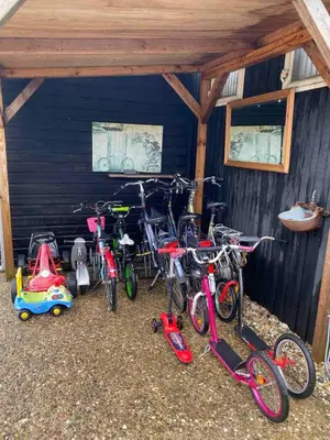 a group of bikes parked in a garage at La Luna - Denise in Heerhugowaard