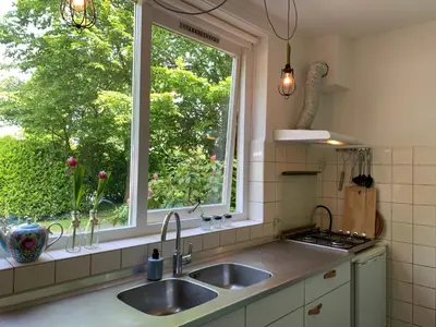 a kitchen with a sink and a window at Loveland in Bergen