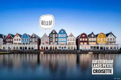 a picture of a row of houses next to the water at Luxury Harbour Suite With Private Parking in Loosdrecht