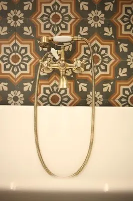a shower in a bathroom with a wall at Luxury Harbour Suite With Private Parking in Loosdrecht