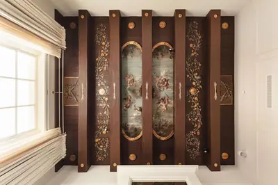 a room with a wall with paintings on it at Waldorf Astoria Amsterdam in Amsterdam