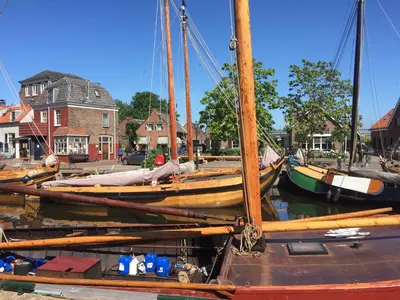 a group of boats docked in a harbor at Holiday in Spakenburg Ootje in Spakenburg
