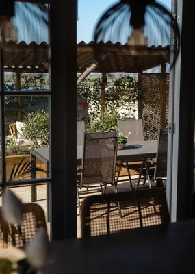 a view of a patio with a table and chairs at Huisje Hartenlust in Bodegraven