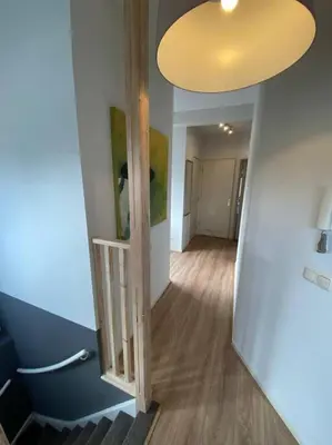 a room with a hallway with a large light at Beach nearby, close to Amsterdam, The Hague -6p in Wassenaar