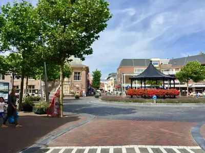 a city street with a pavilion in the middle of a town at @54 in Zandvoort